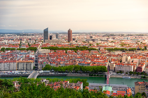 Aerial view of Lyon cityscape with Saone river, La Part-Dieu business district skyscrapers and buildings in background. Photo taken in Lyon famous city, Unesco World Heritage Site, in Rhone department, Auvergne-Rhone-Alpes region in France, Europe during a sunny summer day.