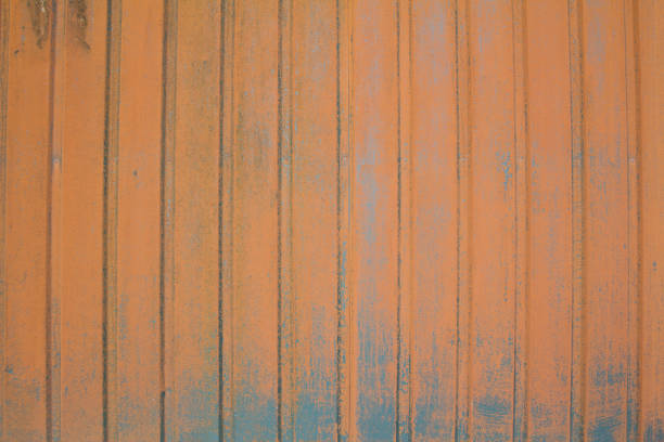 Old red shabby and rusted metal surface with corrosion stains texture background.