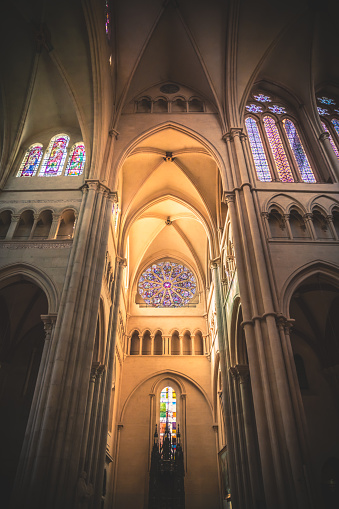 Interior view without people of the majestic and bright architecture of Saint Jean Baptiste cathedral monument in Lyon old town, also called Vieux Lyon in french. Photo taken in Lyon famous city, Unesco World Heritage Site, in Rhone department, Auvergne-Rhone-Alpes region in France, Europe during a sunny summer day.