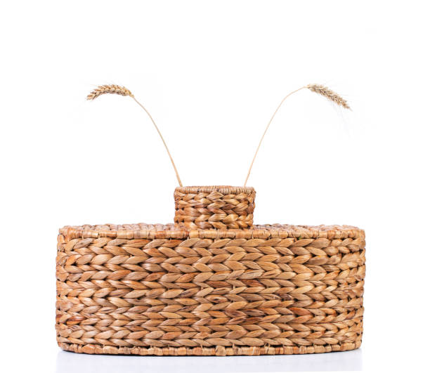 istock Wicker vase with two ears of wheat. 1257436472