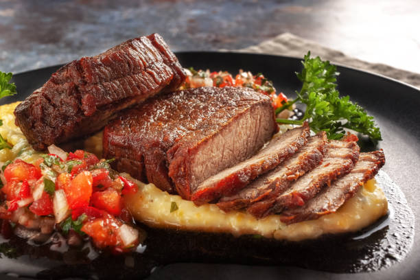 Beef medallions with tomato salsa and cream polenta On a dish beef medallions with tomato salsa and cream polenta roasted stock pictures, royalty-free photos & images