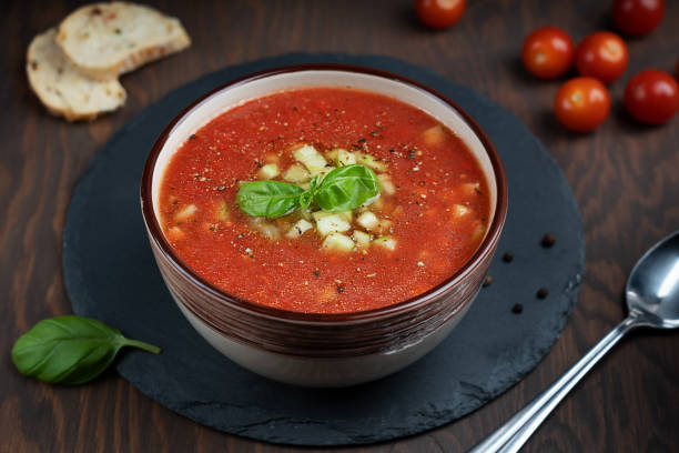 istock Red gazpacho soup on stony tray on wooden table 1257440042
