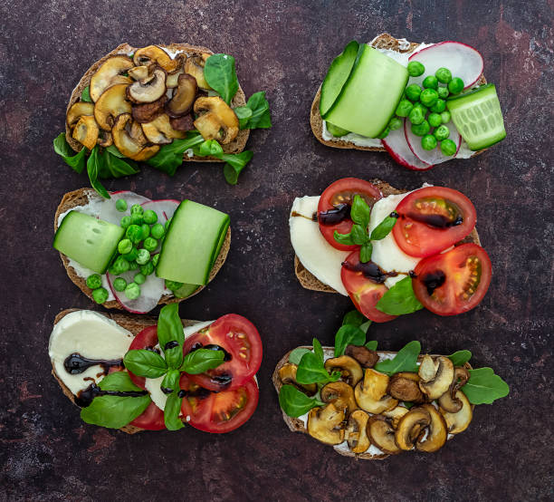 istock Open vegan toasts with different toppings, top view. 1257441133
