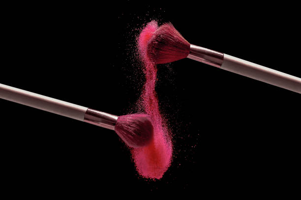 makeup brushes splashing colored powder - face powder exploding make up dust imagens e fotografias de stock