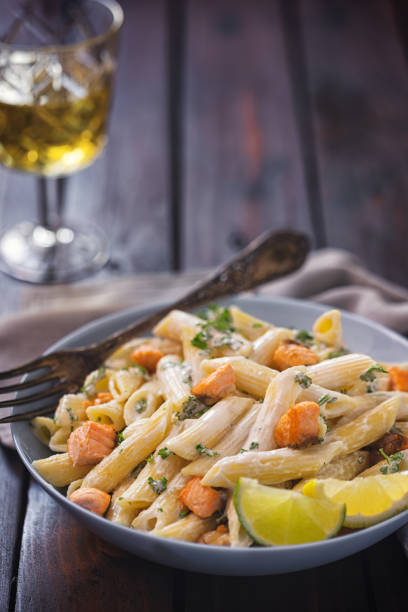 istock Penne with grilled salmon and herbs 1257445895
