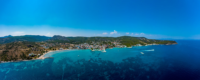 Aegina, Egina, aerial panoramic photo of the town, port and beach of Agia Marina at summer