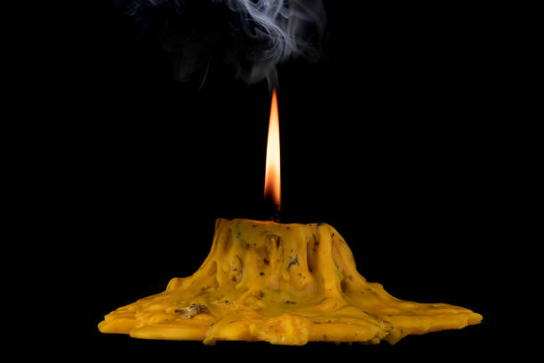 istock light flame candle burning brightly on black background 1257447492