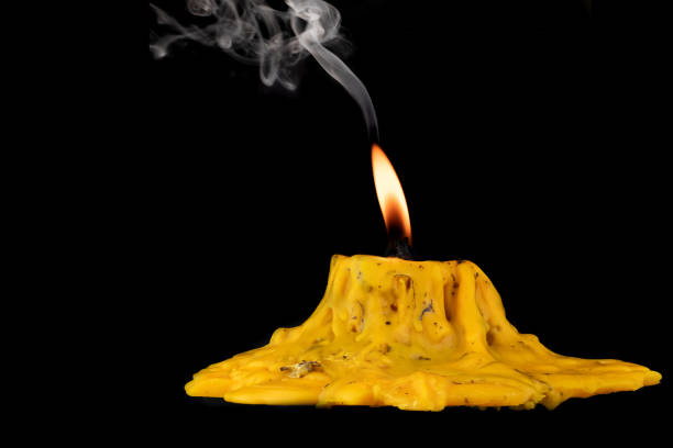 istock light flame candle burning brightly on black background 1257448188