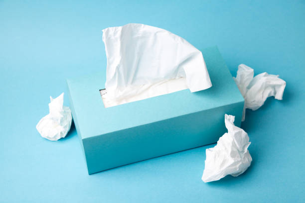 istock Cold and flu concept with a tissue box and crumpled tissues 1257449599