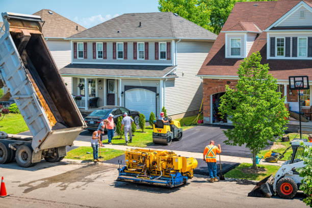 Driveway paving asphalt pavement resurfacing Workers work during driveway paving in front of a house in Brantford Ontario Canada. residential asphalt paving stock pictures, royalty-free photos & images