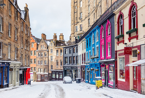 Edinburgh, Scotland - Snow covering the curving hill of Victoria Street in the historic Old Town of Edinburgh,