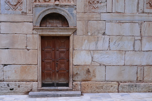 An ancient door of a Byzantine church in the old city centre of Athens (Greece)