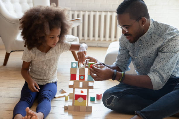 istock Loving biracial dad play blocks with little daughter 1257454178