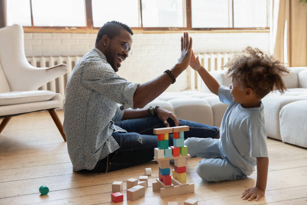 istock Excited biracial dad and son give high five playing 1257454185