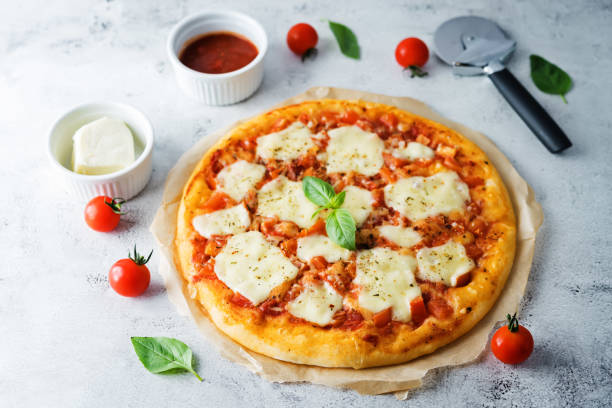 istock Pizza Margarita with tomato sauce and Mozzarella cheese 1257454367