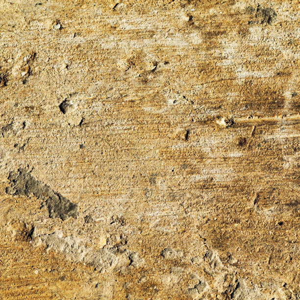 istock Abstract concrete, weathered with cracks and scratches. Landscape style. Grungy Concrete Surface. Great background or texture. 1257454952