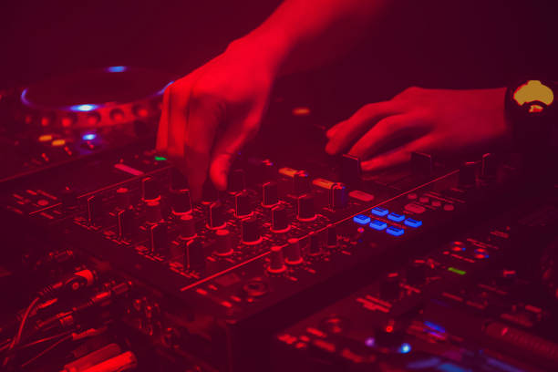 istock Dj's hands and music mixer 1257461953