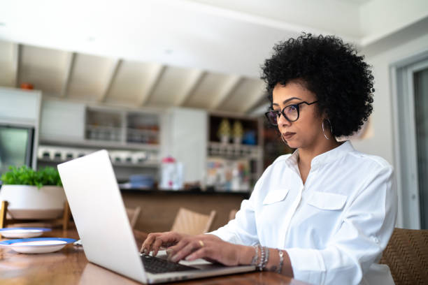 istock Mature woman working at home, using laptop 1257463327