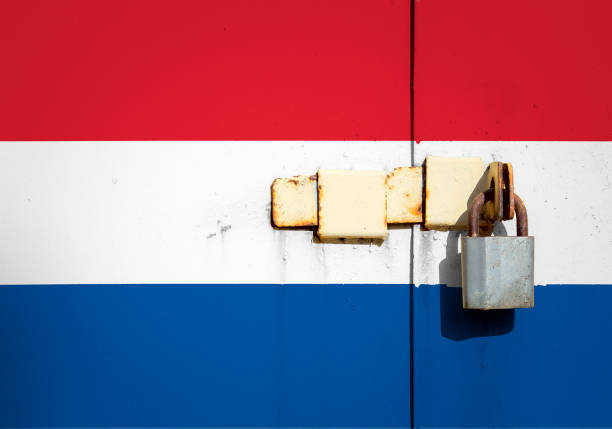 Netherlands flag is on texture. Template. Coronavirus pandemic. Countries are closed. Locks.