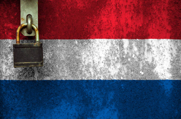 istock Netherlands flag is on texture. Template. Coronavirus pandemic. Countries are closed. Locks. 1257465693