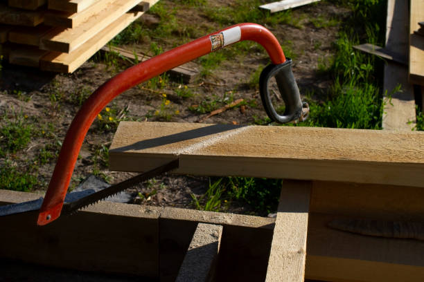 istock construction with a hand saw in the summer. 1257466767