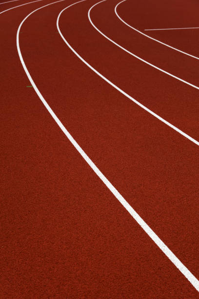istock Red stadium running tracks closeup 1257467731