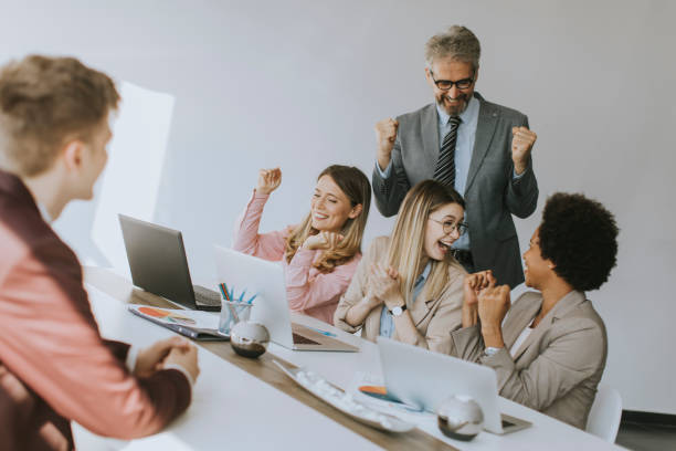 istock Group of multiethnic business people hear great news while working on new project 1257468023