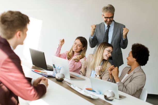 istock Group of multiethnic business people hear great news while working on new project 1257468033