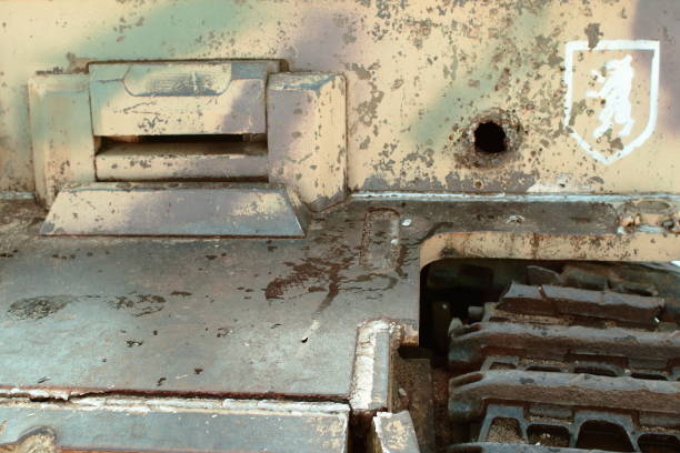 istock Old battle tank 2nd World War in the snow under the trees. 1257471436
