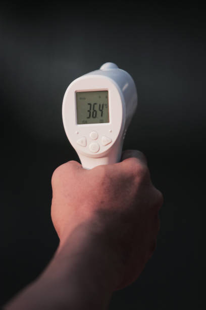 istock Thermo gun, a tool to measure body temperature 1257481157