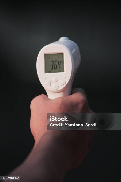 Thermo Gun A Tool To Measure Body Temperature Stock Photo - Download Image  Now - Gun, Fever, Meter - Unit of Length - iStock