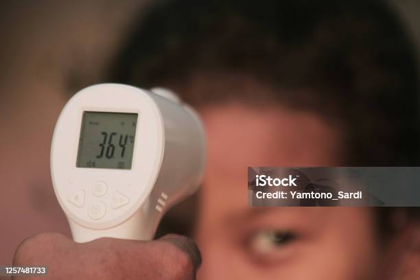 Check Body Temperature With A Thermo Gun Stock Photo - Download Image Now -  Army Soldier, COVID-19, Care - iStock