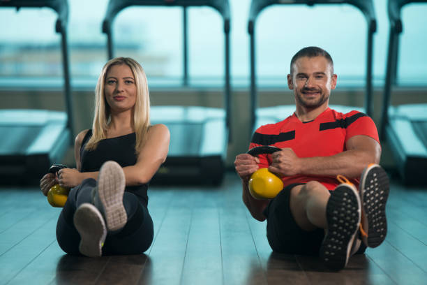 istock Group Of People Exercise With Kettle Bell 1257483217