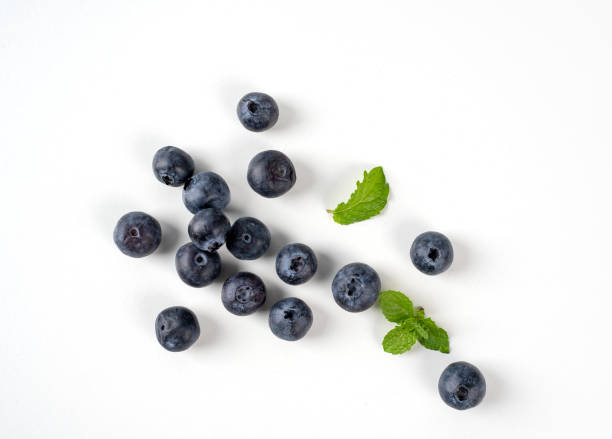 istock Blueberry fruit top view isolated on a white background, flat lay overhead layout with mint leaf, healthy design concept. 1257485329