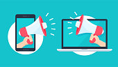 istock Megaphone reaching out from the smartphone and laptop screen to shout alerts for product promotions. 1257485369
