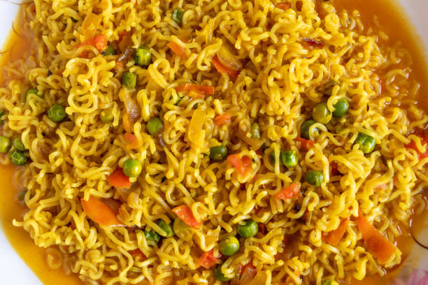 istock Spicy fried instant noodles with vegetable, close up top view 1257490315