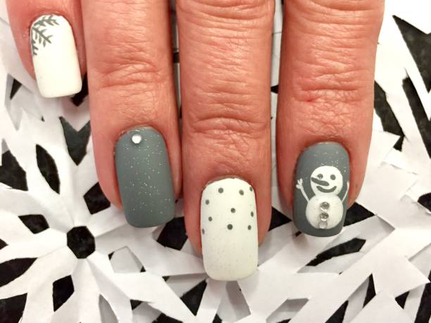 istock Snowman and Snow Flakes Nail Art Design 1257490525