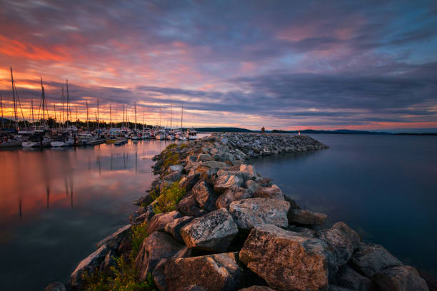 Sunset In Sidney, British Columbia Sunset at the Sidney marina. groyne stock pictures, royalty-free photos & images