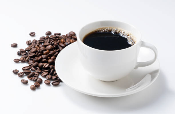 istock Hot coffee and coffee beans on a white background 1257499489