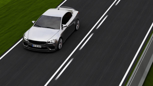 istock car driving on a road 1257503887