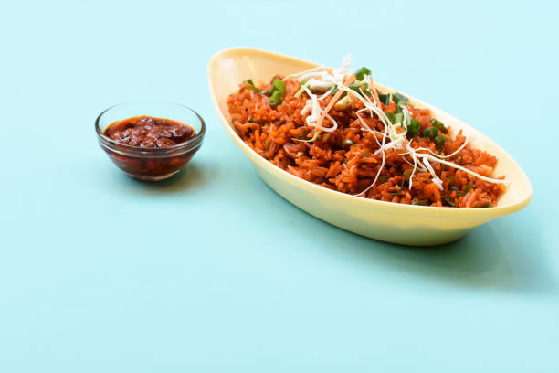 istock Schezwan fried rice with schezwan sauce, Chinese fried rice,garnished with spring onion and cabbage.indo chinese cuisine dishes.selective focus 1257505970