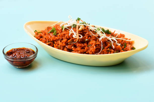 istock Schezwan fried rice with schezwan sauce, Chinese fried rice,garnished with spring onion and cabbage.indo chinese cuisine dishes.selective focus 1257506599