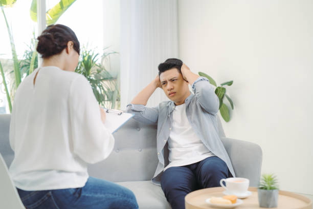 istock Psychotherapist working with young man in office. 1257507321