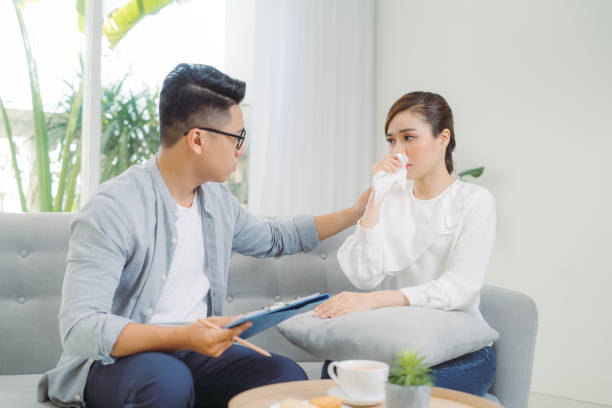 istock Adult man in glasses makes notes. Solving family problems in psychology with his client at office. 1257507352