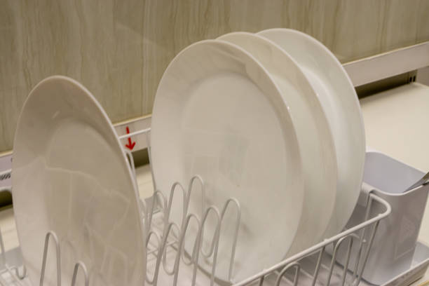 White plate on dish rack stock photo