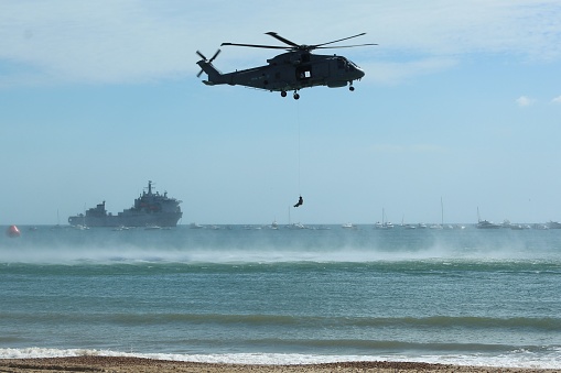 Bournemouth, Dorset/ England - October 14, 2014: A soldier has been air dropped in to the sea for a rescue mission