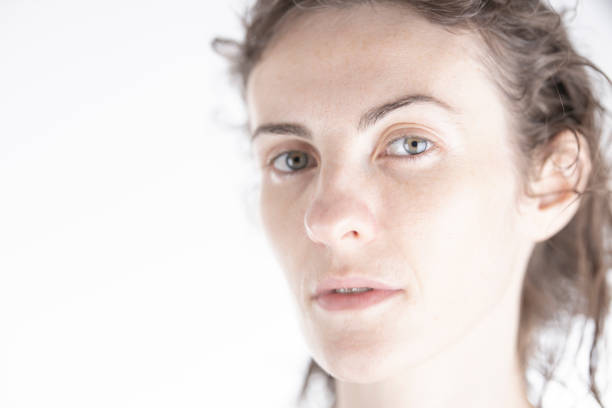 portrait of a young woman in front of white background