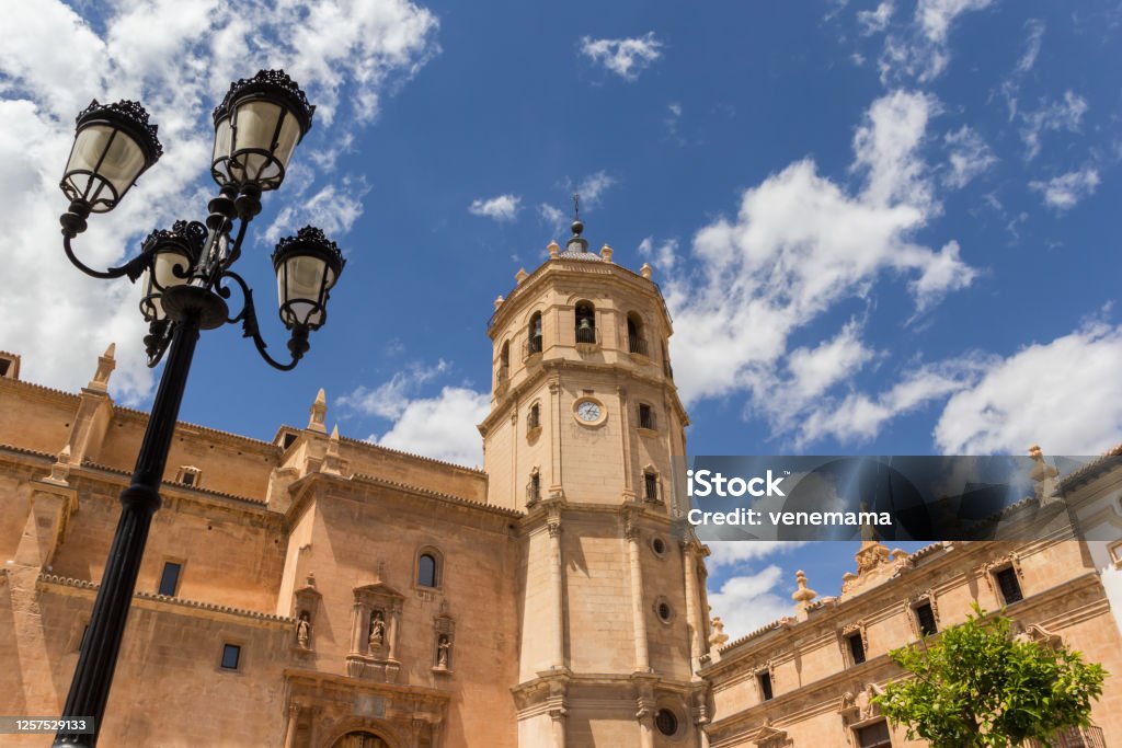 Street light and tower of the San Patricio church in Lorca Street light and tower of the San Patricio church in Lorca, Spain Lorca Stock Photo