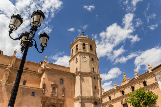 Street light and tower of the San Patricio church in Lorca Street light and tower of the San Patricio church in Lorca, Spain lorca stock pictures, royalty-free photos & images