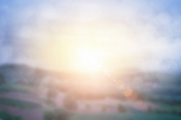 istock Natural background blurring warm colors and bright sun light. Bokeh or tree background green energy at sky sunny color orange light patterns plain abstract flare evening clouds blur. 1257530891